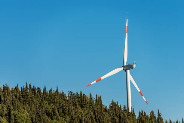 istock Wind Turbine with Blue Sky and Trees 897963534