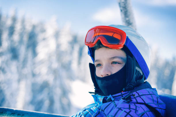 istock Little skier on the ski lift 897966560