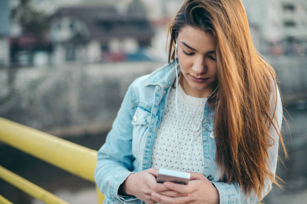 istock Depressed girl alone in the city. 897972128