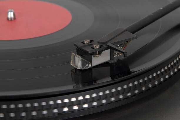 istock Pickup on a vinyl LP. Focus on the pickup head. 897973008