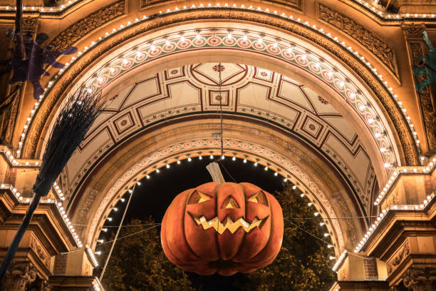 istock Big Halloween pumpkin hanging in archway 897975714