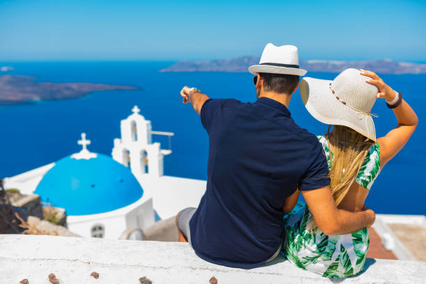 istock Happy young couple on Santorini island, Greece 897976006