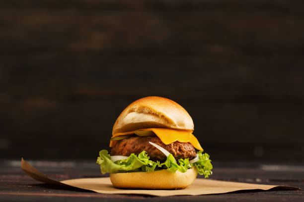 istock Homemade Hamburger on Dark Wooden Background 897982650