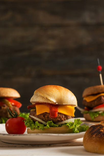 istock Homemade Hamburger on Dark Wooden Background 897982652