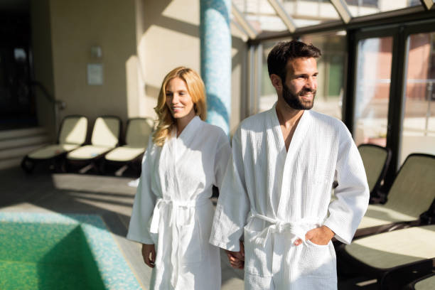 istock Beautiful cheerful couple relaxing in spa center 897982932