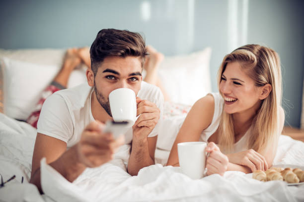 istock Young loving couple in the bed 897995118