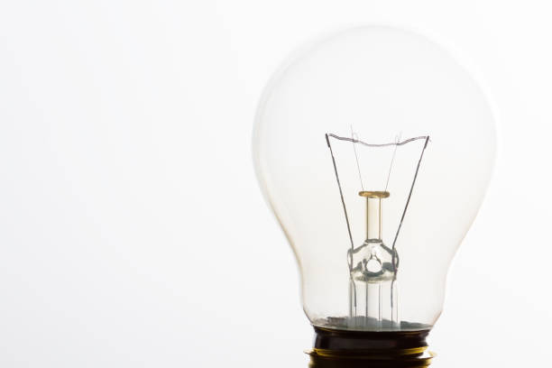 istock Light bulb macro with the filament wire and construction in artistic conversion 898001214