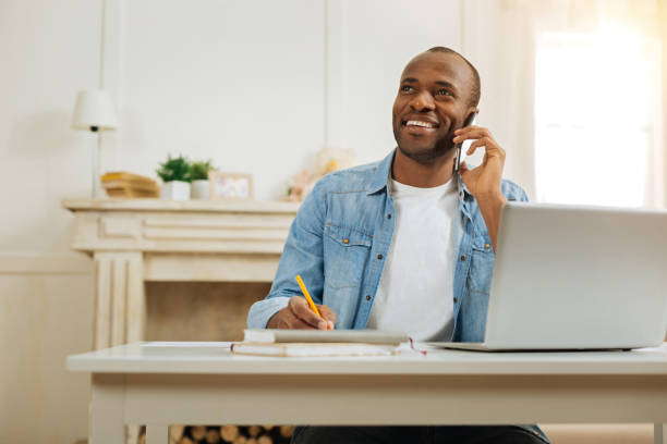 istock Alert man talking on the phone and working 898009710