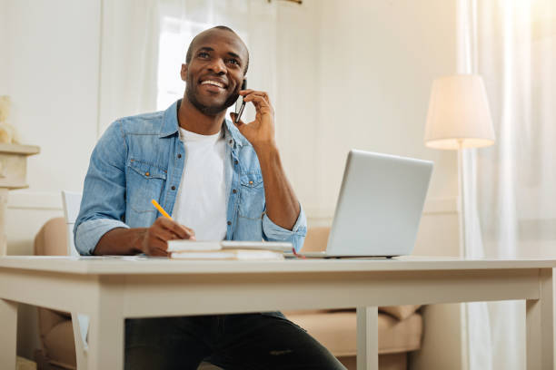 istock Happy freelancer talking on the phone and working 898009822