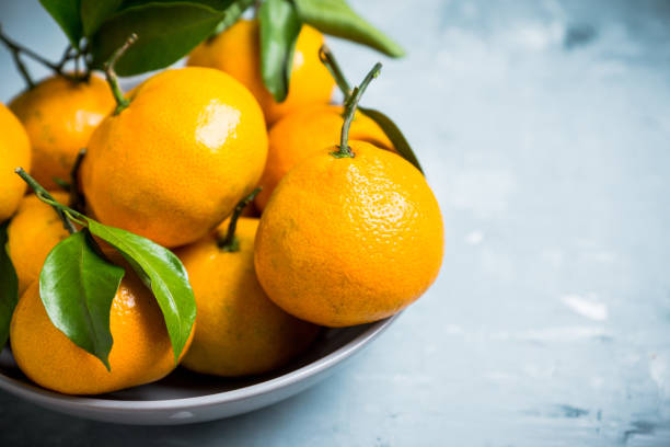 istock Tangerines on the wooden background 898010768