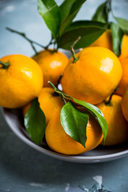 istock Tangerines on the wooden background 898010772