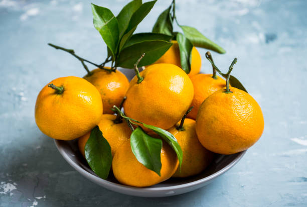 istock Tangerines on the wooden background 898010798