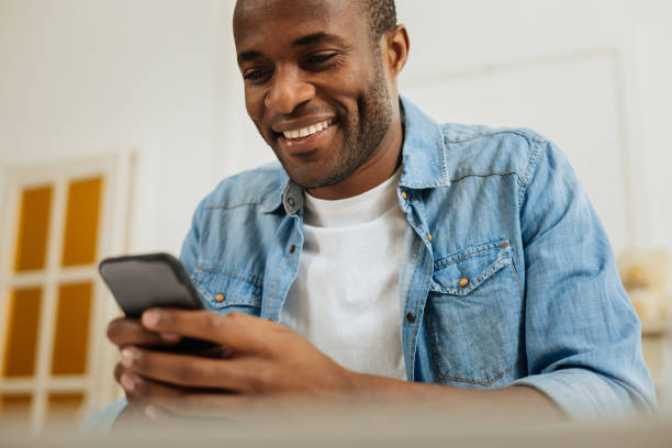 istock Exuberant man chatting on his phone 898011588