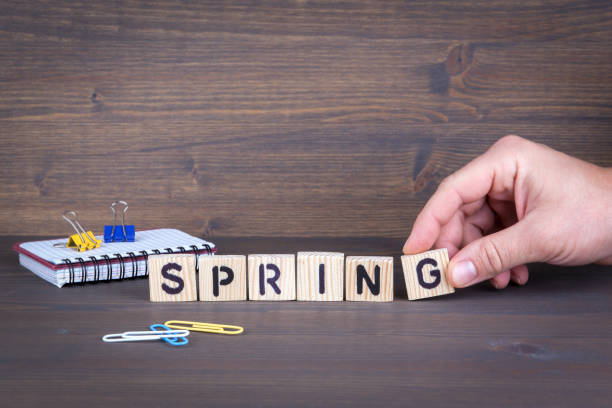 istock spring. Wooden letters on the office desk, informative and communication background 898034884