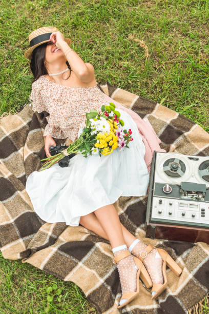 istock stylish girl with camera in park 898043312