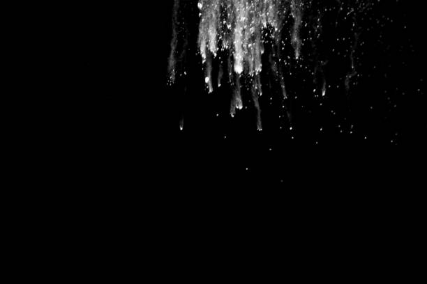 istock Launched white powder splash on black background. Bizarre forms of of white powder explosion cloud against dark background. 898043764