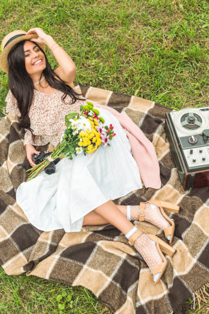 istock stylish girl with camera in park 898049188