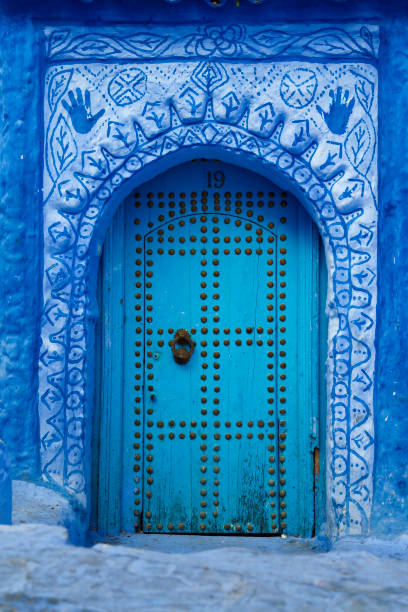 Chefchaouen door Blue door in old town (medina) in Chefchaouen, Morocco. chefchaouen photos stock pictures, royalty-free photos & images