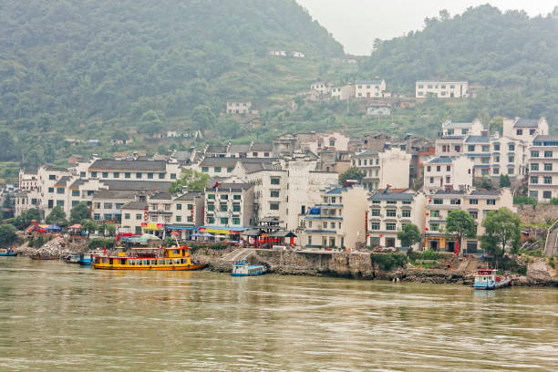 Boats moored in the town of Yiching Boats moored on the quayside of Yiching. yangtze river stock pictures, royalty-free photos & images