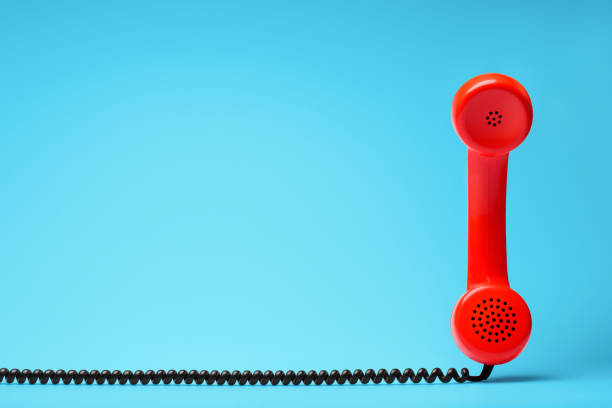 istock Red telephone in retro style on blue background. 898063248