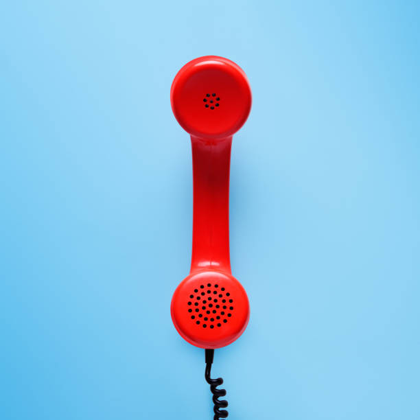 istock Red telephone in retro style on blue background. 898066028