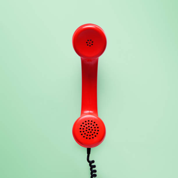 istock Red telephone in retro style on green background. 898066216