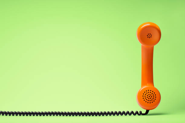 istock Telephone in retro style on green background. 898066454