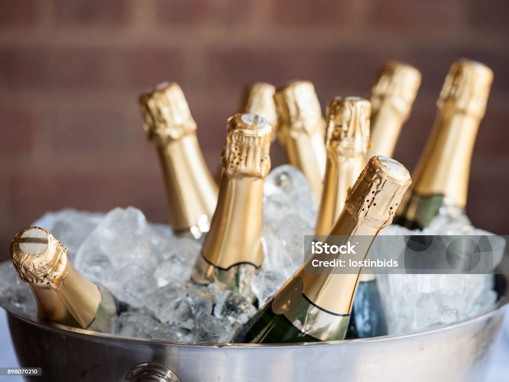 Champagne on Ice Champagne bottle in a bucket of ice. Champagne Stock Photo