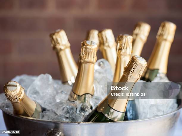 Champagne On Ice Stock Photo - Download Image Now - Champagne, Bottle, Ice