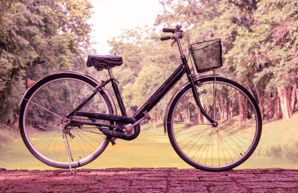 istock Vintage bicycle parked on the road. Warm tone. 898074504