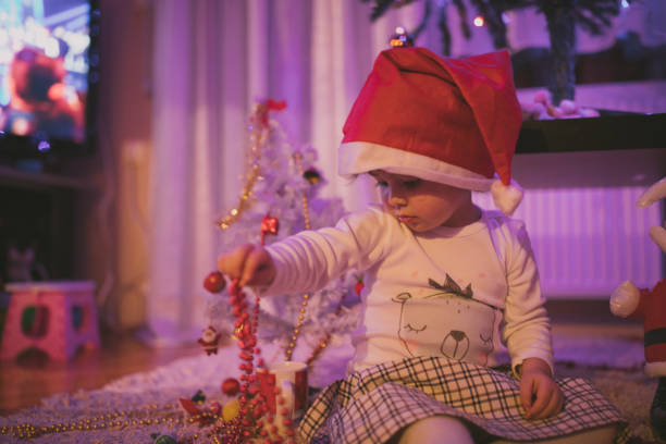 istock Cute little girl with Christmas Tree 898079050