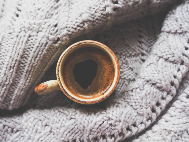 istock Winter coffee. Cup of black coffee at the window. 898080048