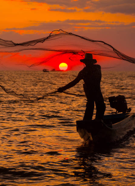 istock Asian fisherman 898095154