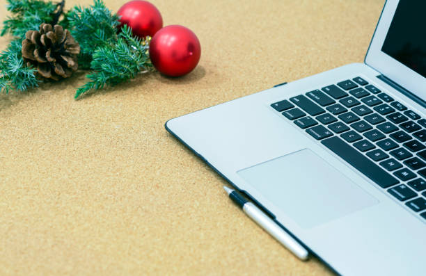 istock Desk during the holidays with Christmas decorations and a pen and notebook 898095658