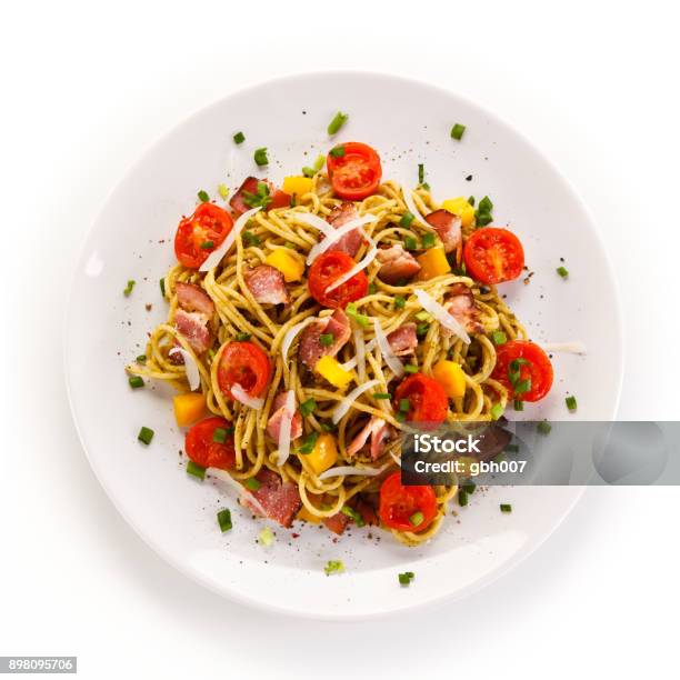 Pasta With Meat Tomato Sauce And Vegetables Stock Photo - Download Image Now - White Background, Plate, Food