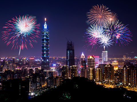 Firework with cityscape nightlife view of Taipei. Taiwan city skyline at twilight time, public scene from view point.