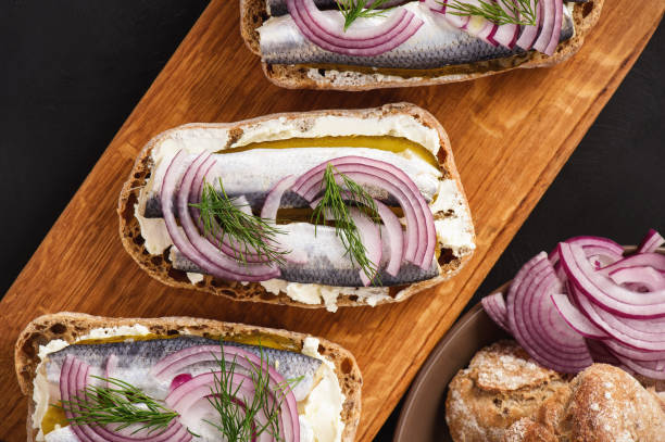 istock Herring sandwiches with pickled cucumber. 898103154