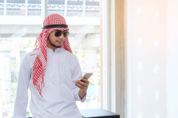 istock business communication concept : professional middle eastern arab businessman working on smartphone 898108640