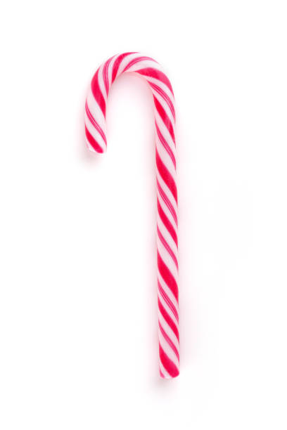 рождественские конфеты cane изолированы на белом - stick of hard candy candy striped toughness стоковые фото и изображения