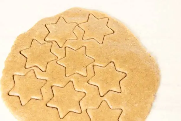 Raw dough. Pattern ginger biscuits. Star shape.
