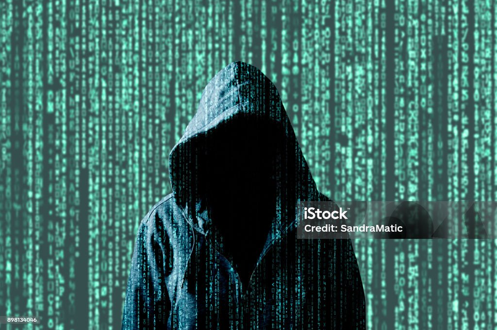 Anonymous computer hacker Anonymous computer hacker, concept for network security, cyber attack or ransomware Encryption Stock Photo