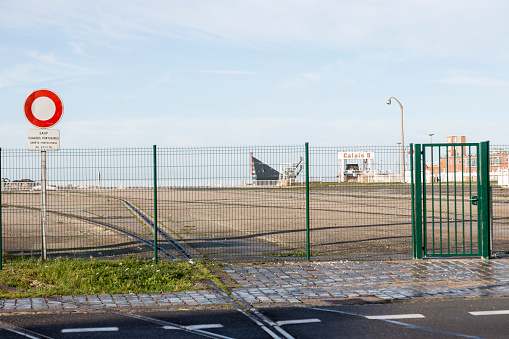 Calais, France, December 20, 2017: A fence around ferry terminal zone in Calais