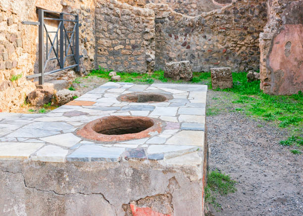 istock Table with pots in ancient city Pompeii 898153272