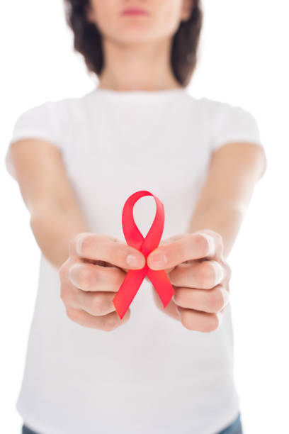 istock woman with aids ribbon 898164952