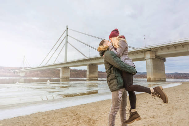 istock Young couple hugging on a cold winter day. 898165136