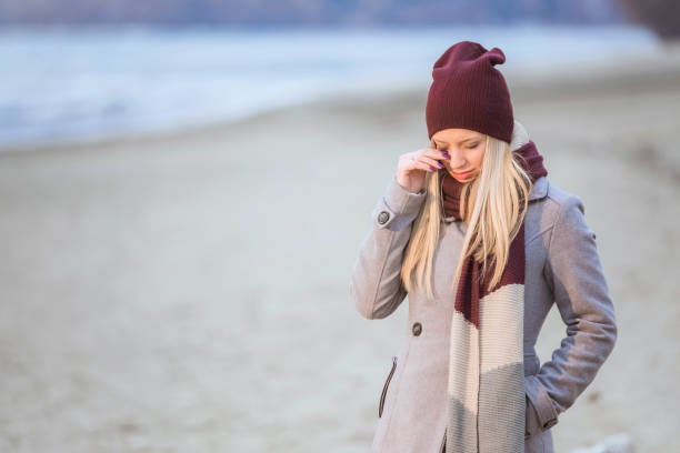 istock Beautiful young woman feeling depressed on a cold winter day. 898165412