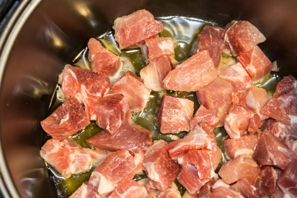 istock Chopped pork meat cooking in slow cooker 898168362