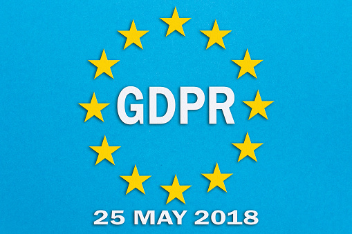 GDPR and the European Union flag on blue background. The illustration in papercut technique.General Data Protection Regulation concept .