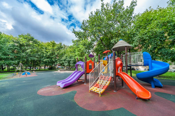 Colorful playground equipment Colorful playground equipment for children in public park in summer schoolyard photos stock pictures, royalty-free photos & images