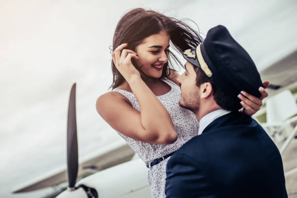 istock Couple near plane. 898185242